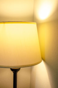 lamp with lampshade producing yellow light